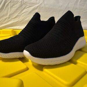 Black and white spandex slip on sneakers